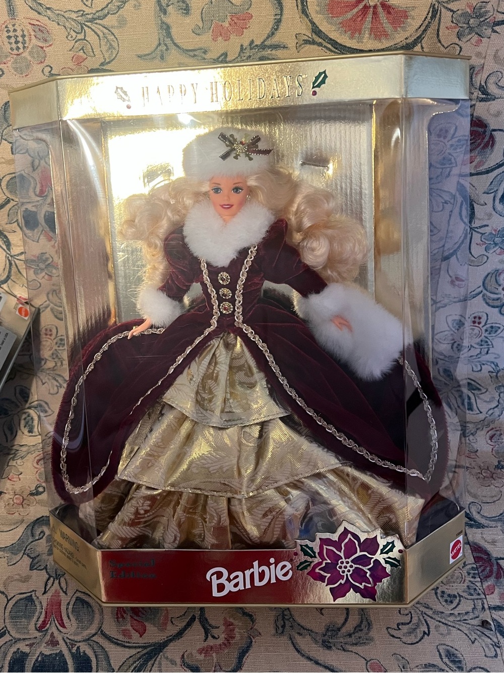1996 Barbie Happy Holidays Doll in Burgundy and Gold. New in Box